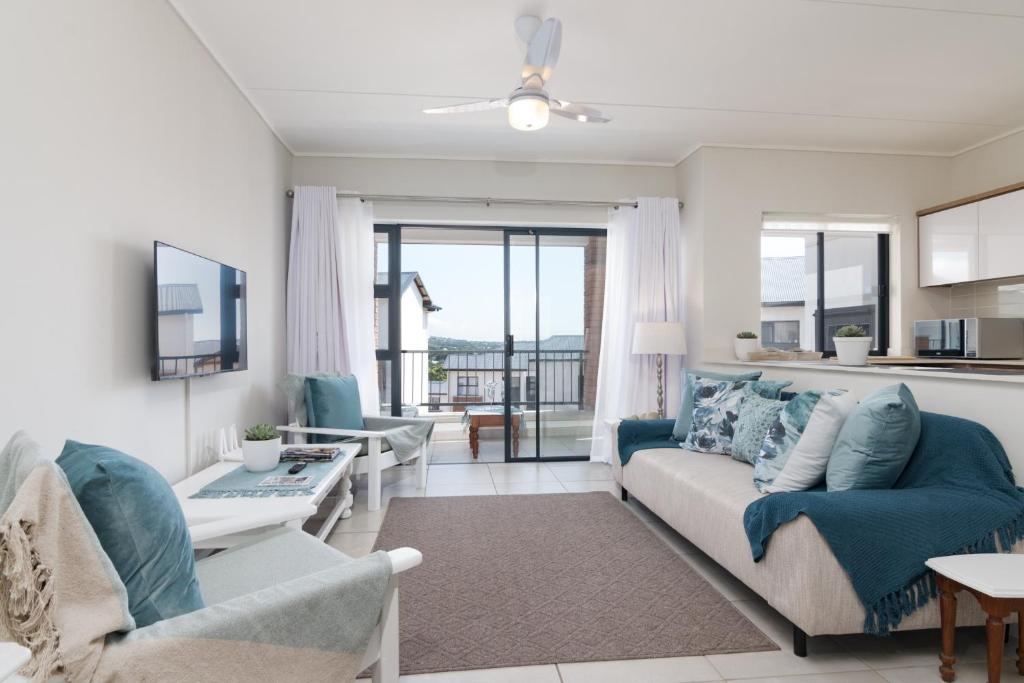 a living room with a couch and a table at Ballito Hills 478 in Ballito
