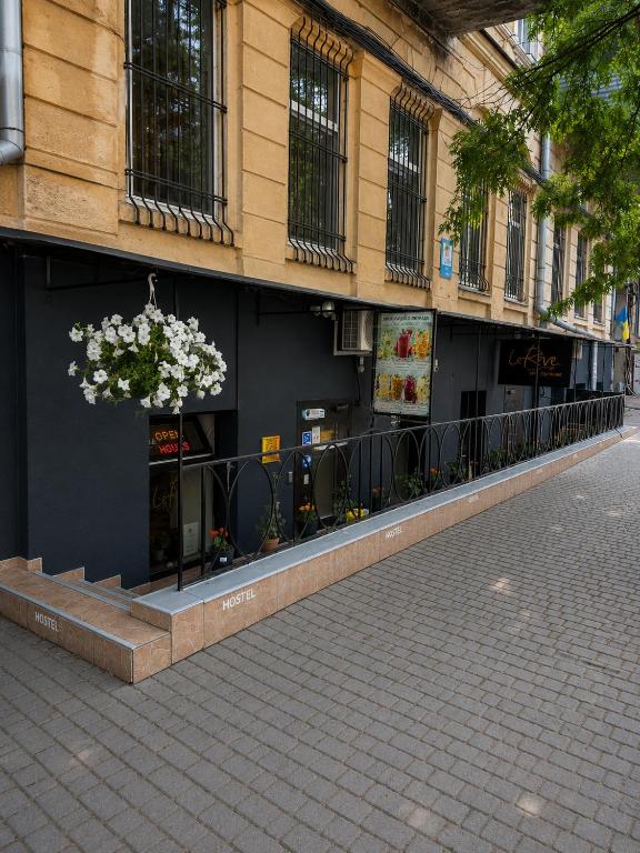 a building with a store with a flower arrangement on it at Le Rêve city hostel in Odesa