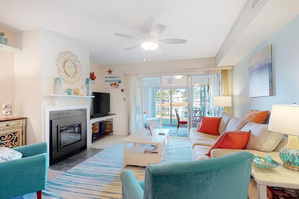 a living room with a couch and a fireplace at Mallard Lakes 158 Cardinal Ln in Selbyville