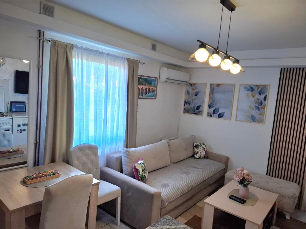 a living room with a couch and a table at Guesthouse Jelena in Višegrad