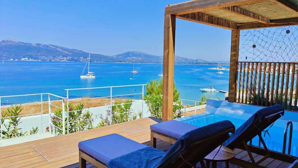 a balcony with a view of the water at Villa Tulivu in Paleros