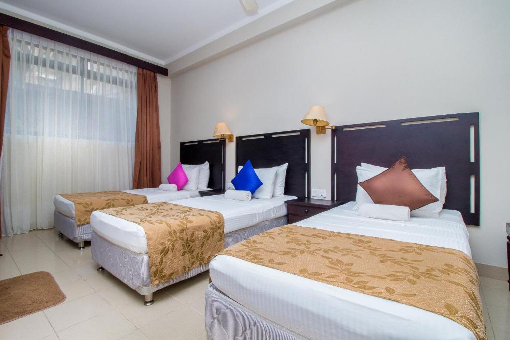 Postel nebo postele na pokoji v ubytování Sevana City Hotel