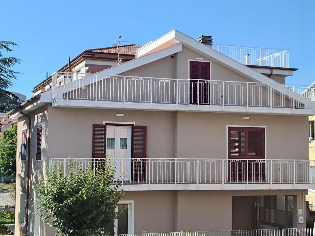 an apartment building with a balcony on the side at La Casa Bianca in Camerano