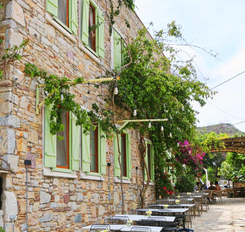 a row of tables outside of a stone building at Just Datça in Datca