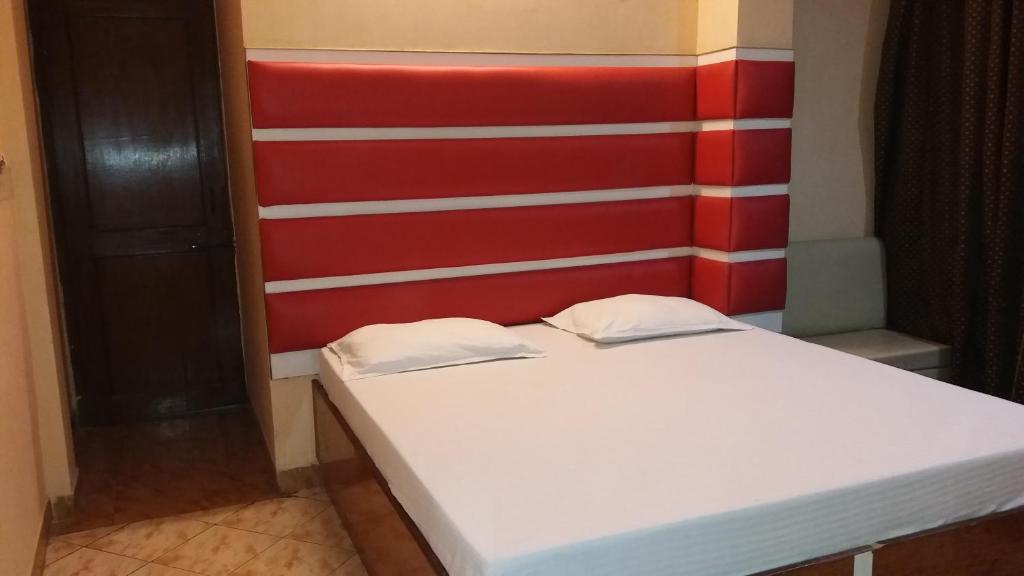 Postel nebo postele na pokoji v ubytování Hotel Kwality