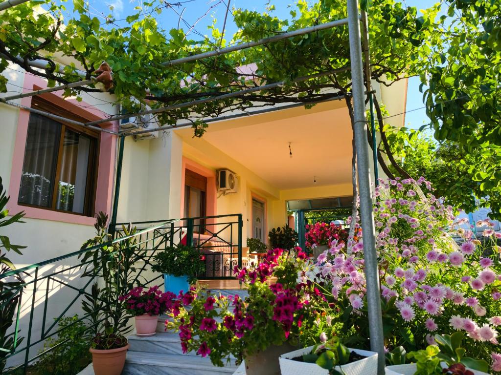 a house with flowers in front of it at Shtepi Manuel in Sarandë