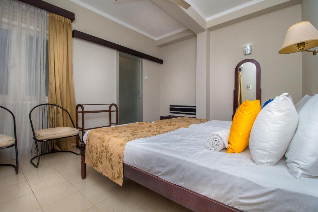 Postel nebo postele na pokoji v ubytování Sevana City Hotel