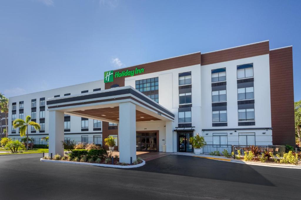 an image of a hotel with a gated entrance at Holiday Inn - Tampa North by IHG in Tampa