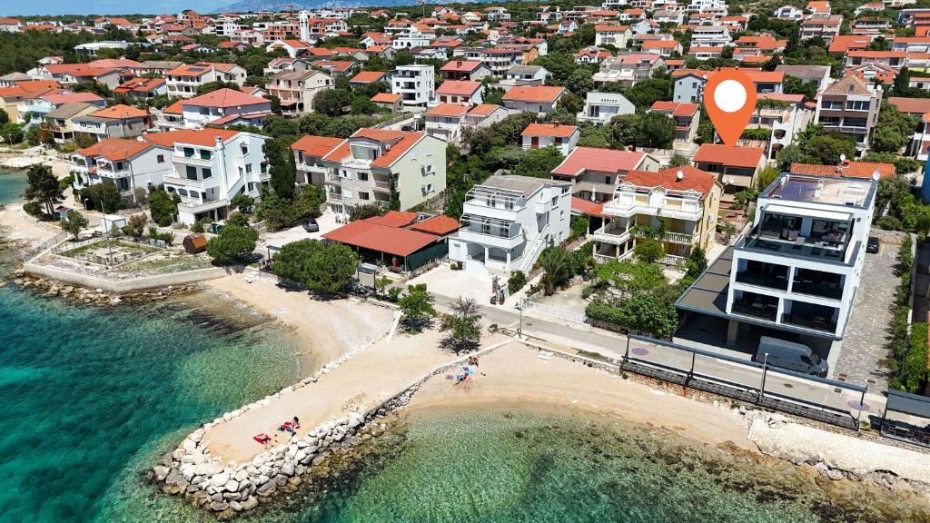 an aerial view of a beach with houses and the ocean at Apartments Lea in Mandre