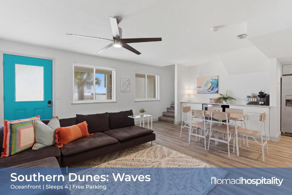 a living room with a couch and a dining room at Be A Nomad - 2BR Jacksonville Beach Apartment - 1 Min to Beach - Sleeps 4 in Jacksonville Beach