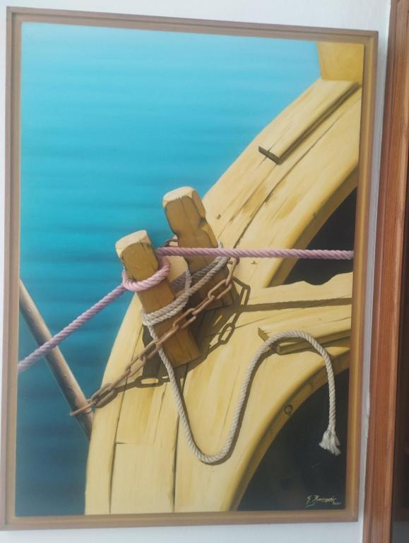 a painting of a boat tied up with ropes at Peramos Luxury 2 in Nea Peramos