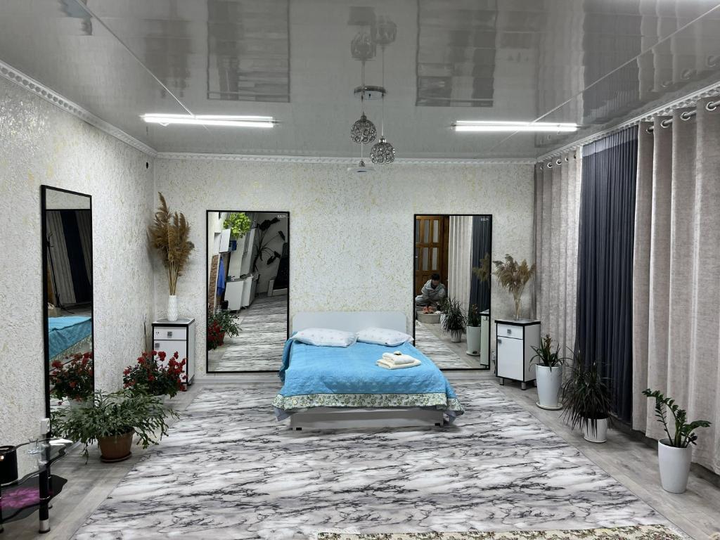 a hospital room with a bed in the middle at Friendly House in Bokonbayevo