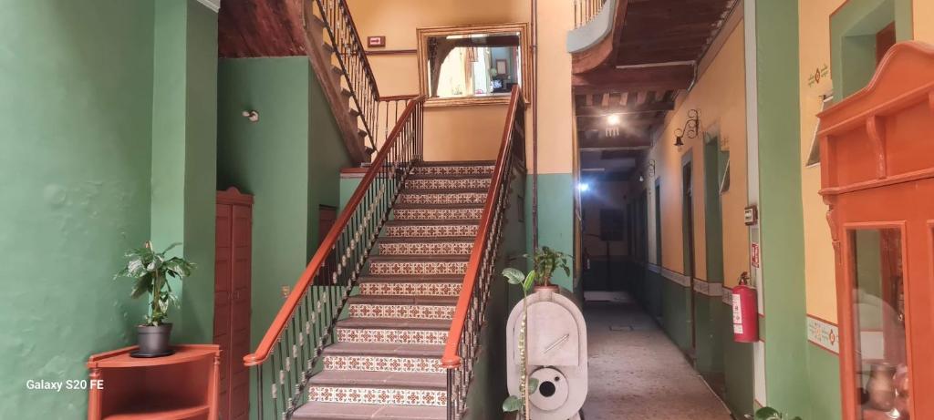 an empty hallway with stairs in a building at Hotel Republica in Mexico City