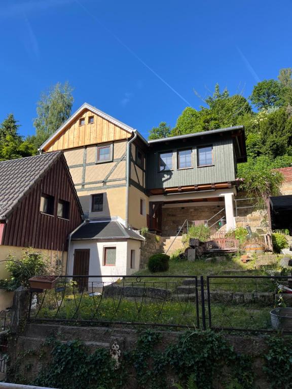a large house on top of a hill at Ferienhaus Königstein in Königstein an der Elbe