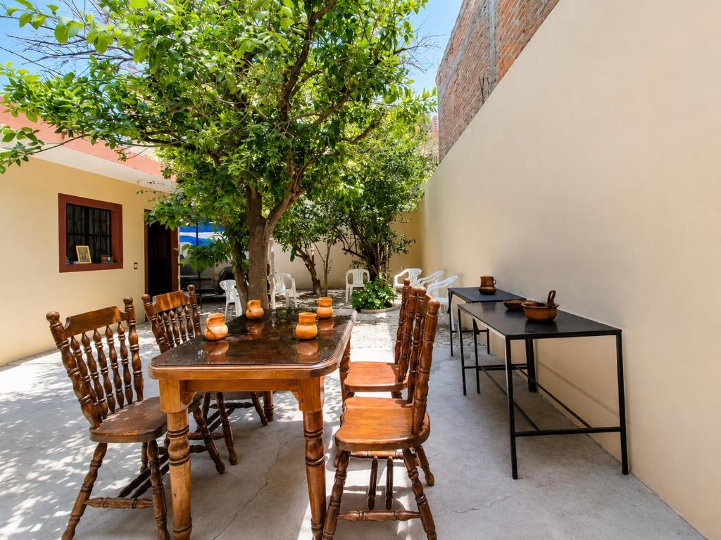 a dining room with a table and chairs at Casa Dolores in Dolores Hidalgo