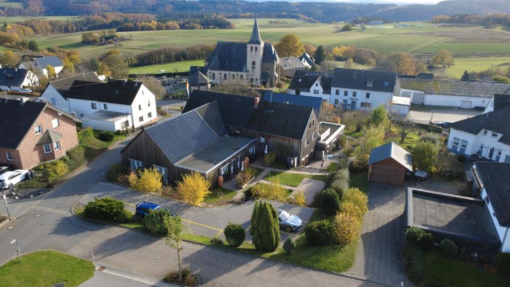 an aerial view of a small town with a church at Race & Rest Apartments in Baar