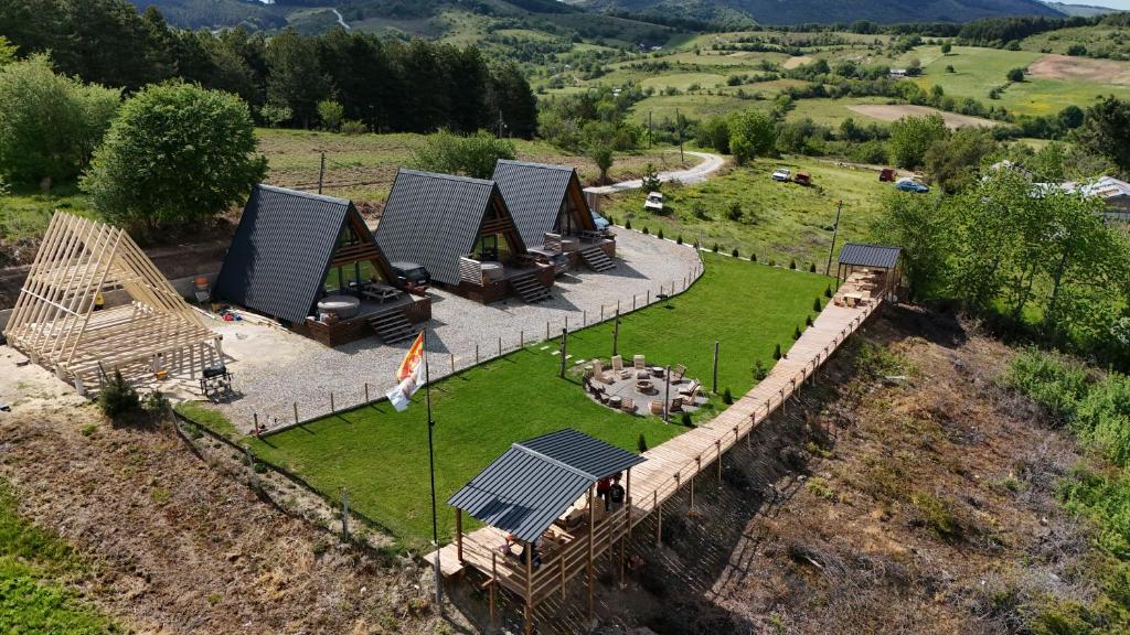 an aerial view of a house with solar panels on a field at Krushevski Konaci 2 in Kruševo