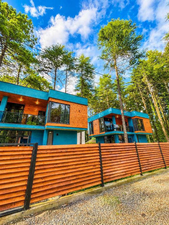 a house with a fence in front of it at Black Sea Gemini in Ureki