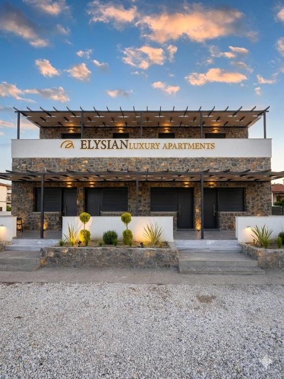 a building with a sign that reads binyan libraryarians at ELYSIAN luxury apartments in Paliouri