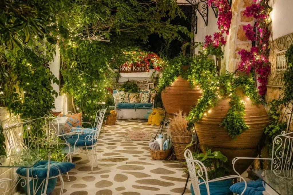 a room filled with lots of plants and flowers at Hotel Kastro in Skiathos