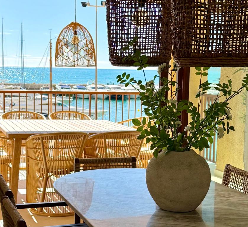 a table with a vase with a plant on it at ALTEA LUXURY - Blue Pearl in Altea la Vieja