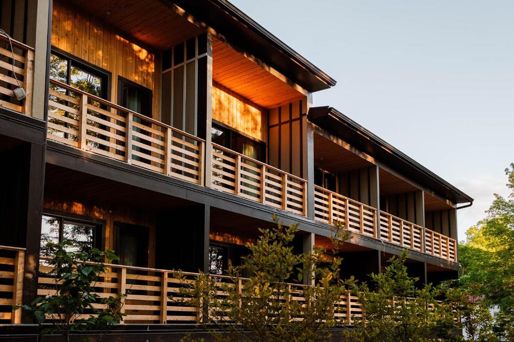 an exterior view of a building with wooden balconies at New Paltz Way Hotel in New Paltz
