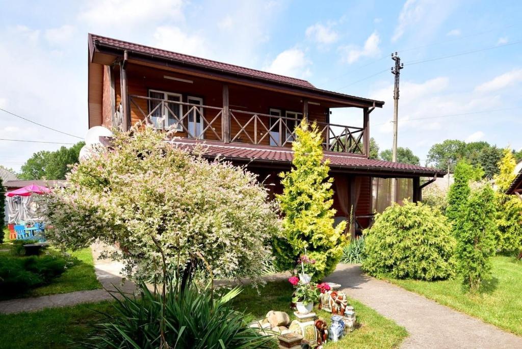 a house with a garden in front of it at Елізабет 1 in Svityazʼ