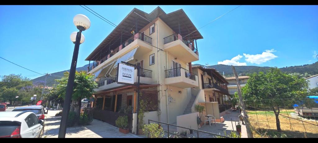 a building on the side of a street at Revival rooms in Nikiana