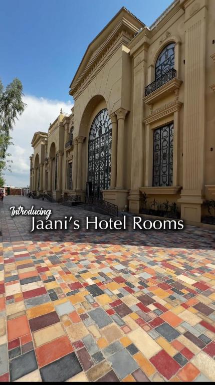 a building with a colorful tiled floor in front of it at JAANI's Hotel in Bhattiawāla