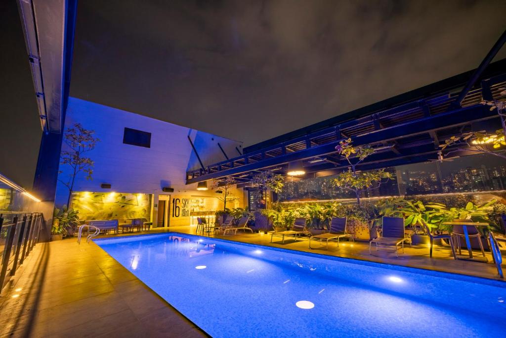a swimming pool in the middle of a building at Hotel Estelar Square in Medellín