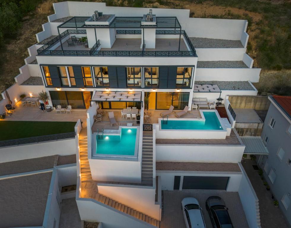 an aerial view of a house with a swimming pool at NS Luxury Villas in Podstrana