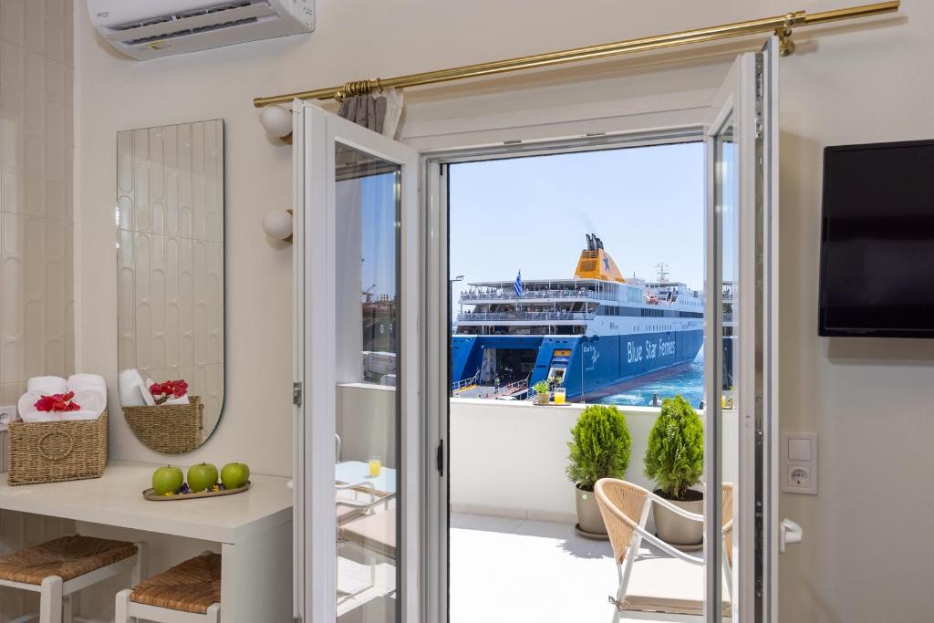a room with a view of a cruise ship at Alexander Seaview Haven in Ermoupoli