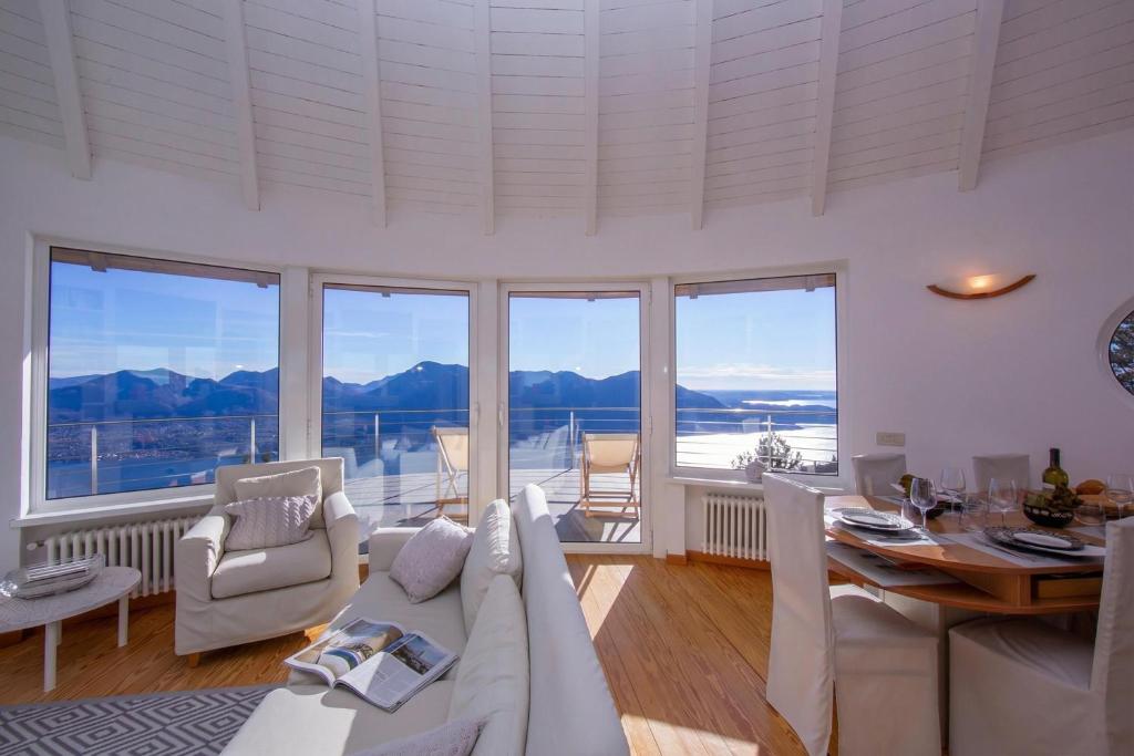 a living room with a couch and a table at The Perfect View in a Premeno Penthouse - Happy Rentals in Premeno