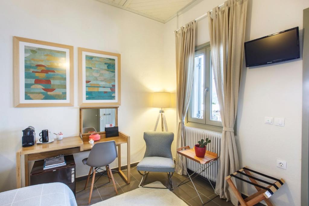 TV a/nebo společenská místnost v ubytování Olga Hotel Mouresi