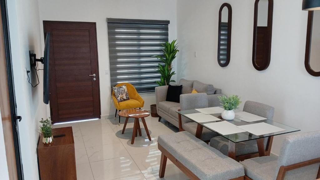 a living room with a couch and a table at Orion department in Tepic