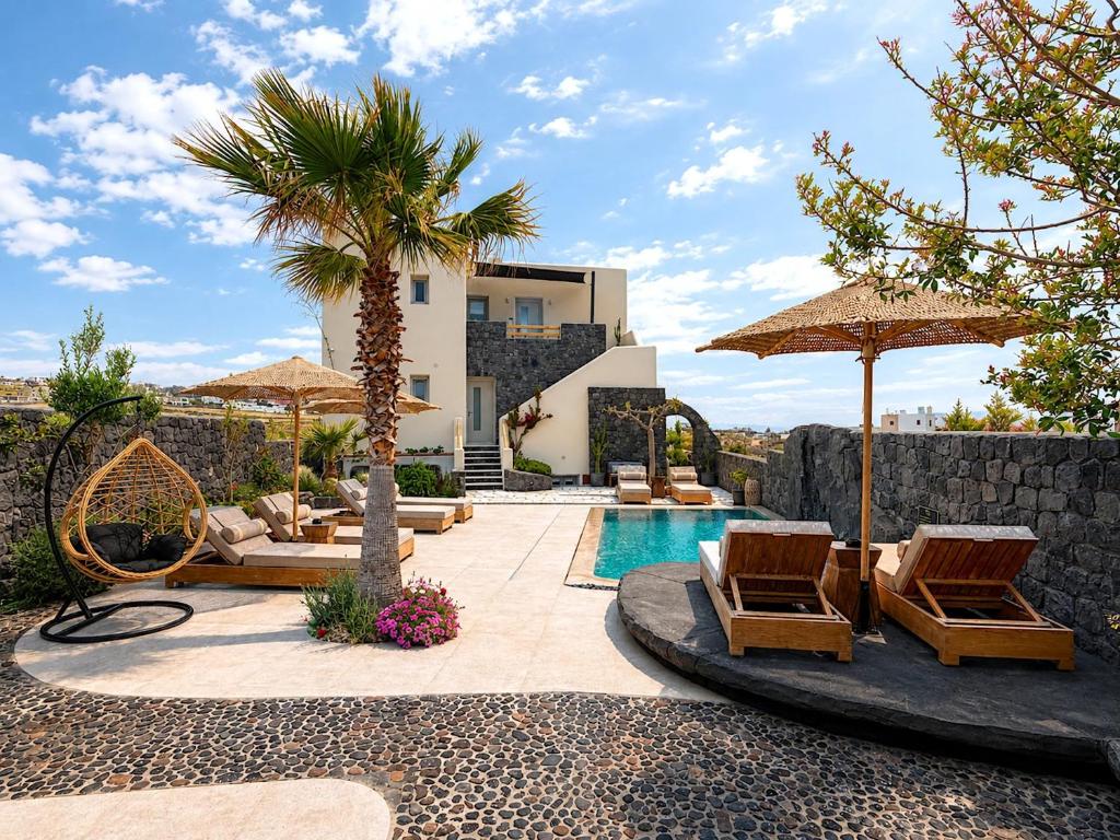 a villa with a pool and chairs and a palm tree at Santa Mar ECO Suites in Karterados