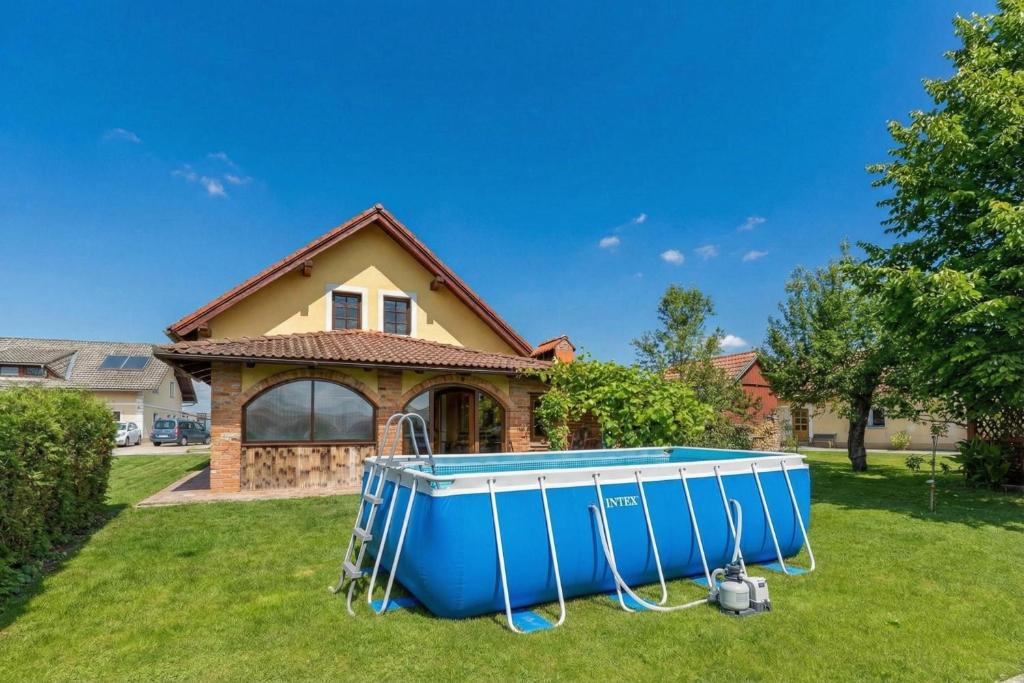 a house with a blue boat in front of it at Forge of Happiness Rustic Retreat - Happy Rentals in Gradac