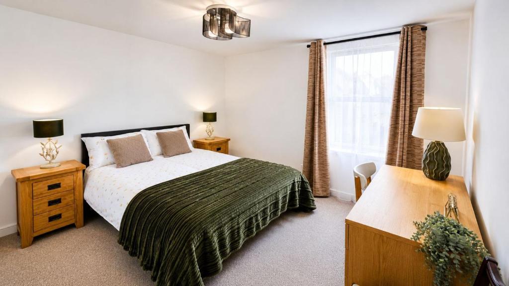 a bedroom with a bed and a window at GALLOWGATE - CITY CENTRE - Free PRIVATE PARKING in Aberdeen