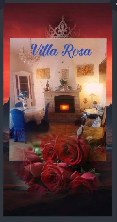 a sign for a living room with roses in front of a fireplace at Villa Rosa in Acqualagna