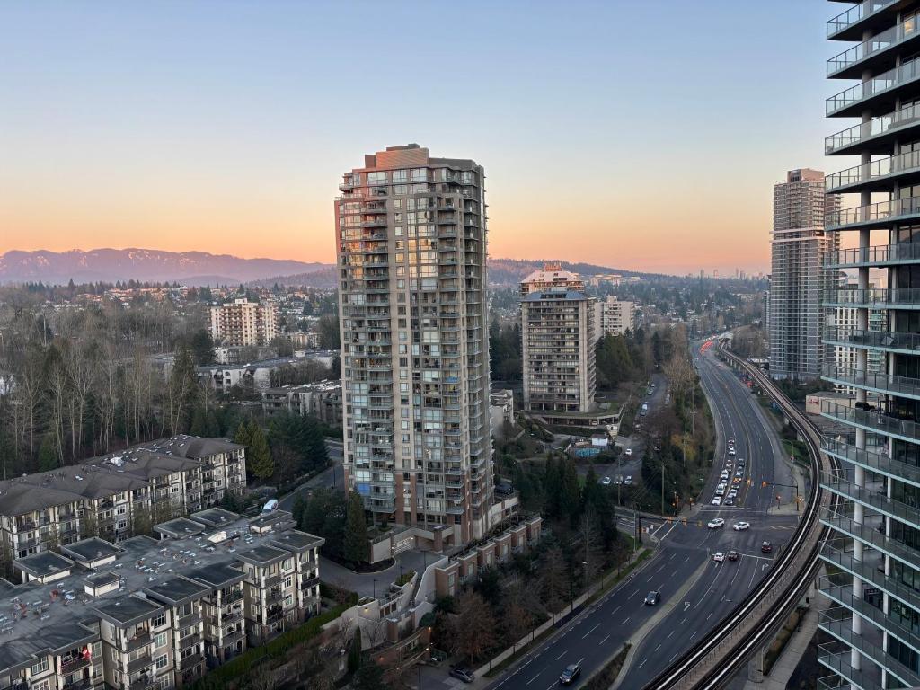 an aerial view of a city with tall buildings at Brentwood Retreat in Burnaby