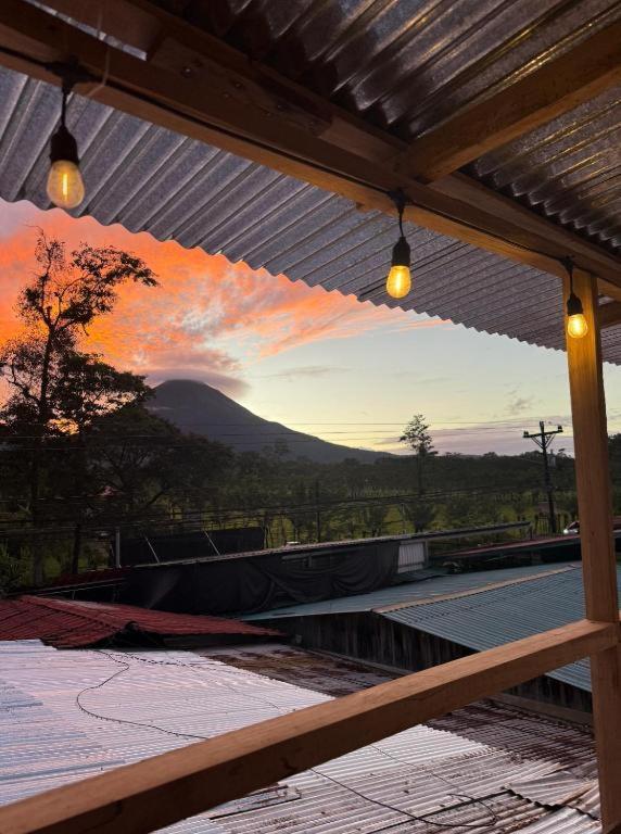 a painting of a sunset on a patio at Blackout Party Hostel and Experiences in Fortuna