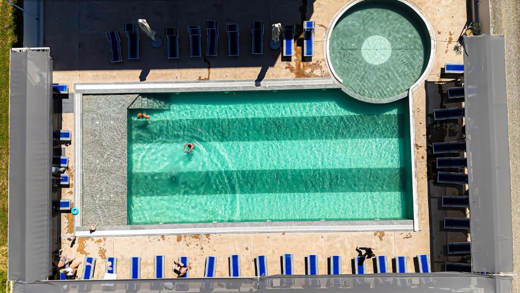 an overhead view of a swimming pool at Imperial Hotel in Tale