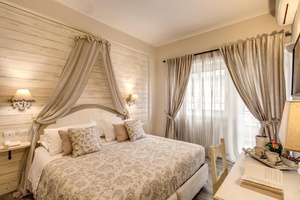 Postel nebo postele na pokoji v ubytování Casa Mia Vaticano Guest House