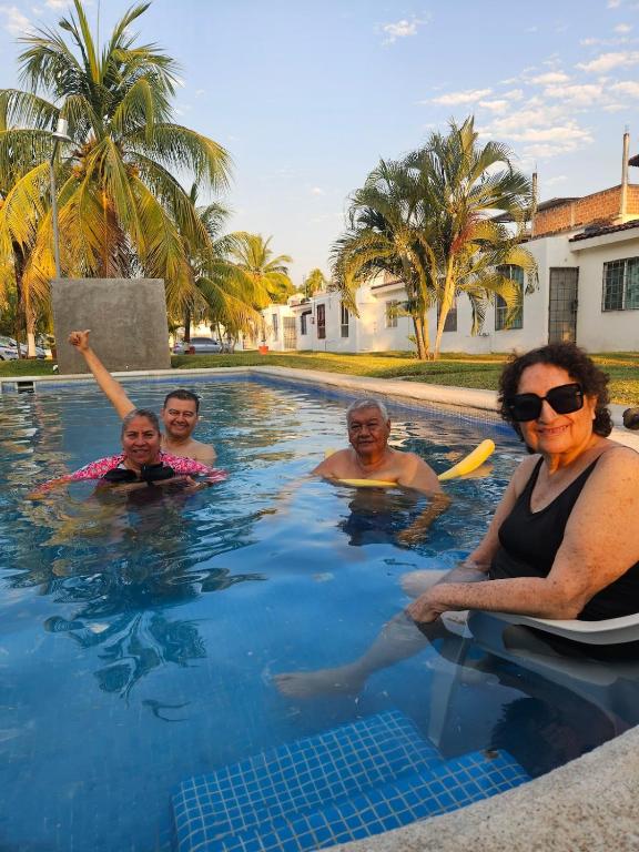 a group of people in a swimming pool at Alojamiento La Vista in Barrio Nuevo