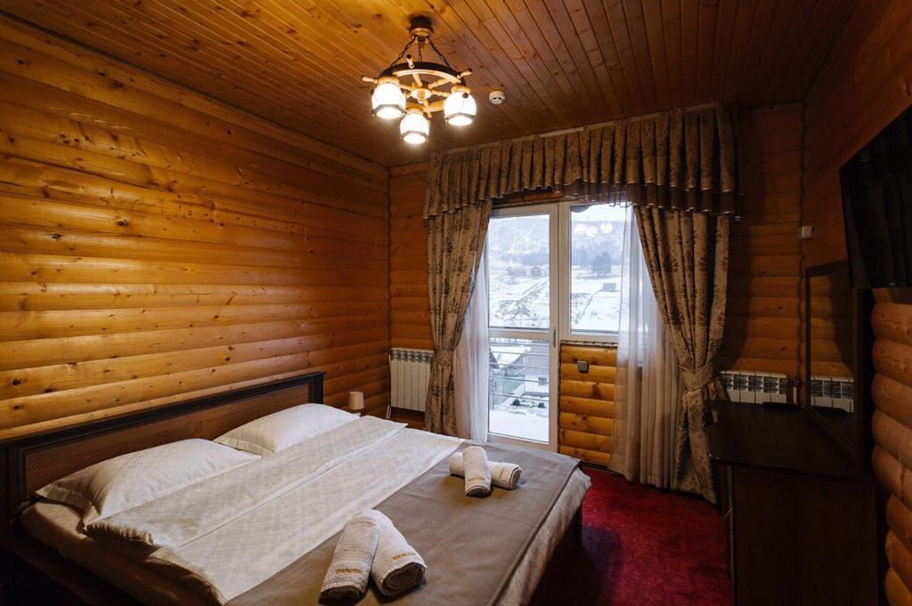 Postel nebo postele na pokoji v ubytování Hotel Marilen