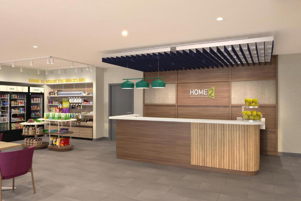 a store lobby with a counter with a home pharmacy at Home2 Suites By Hilton Suffolk in Suffolk