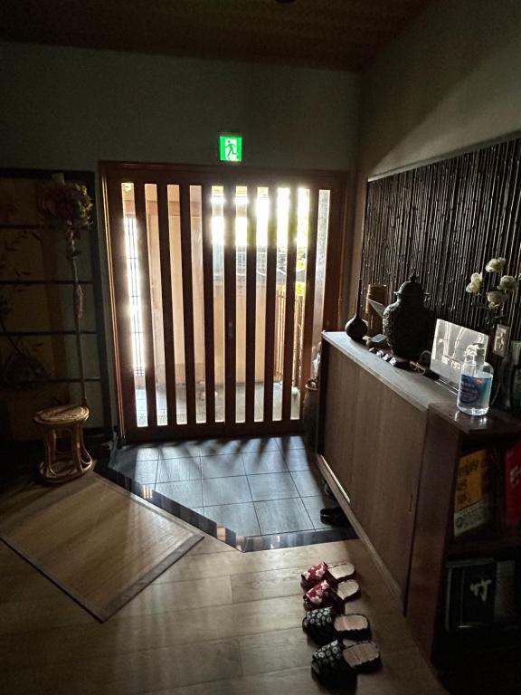 a room with a door with a sign on it at 竹葉庵 in Nagaokakyo