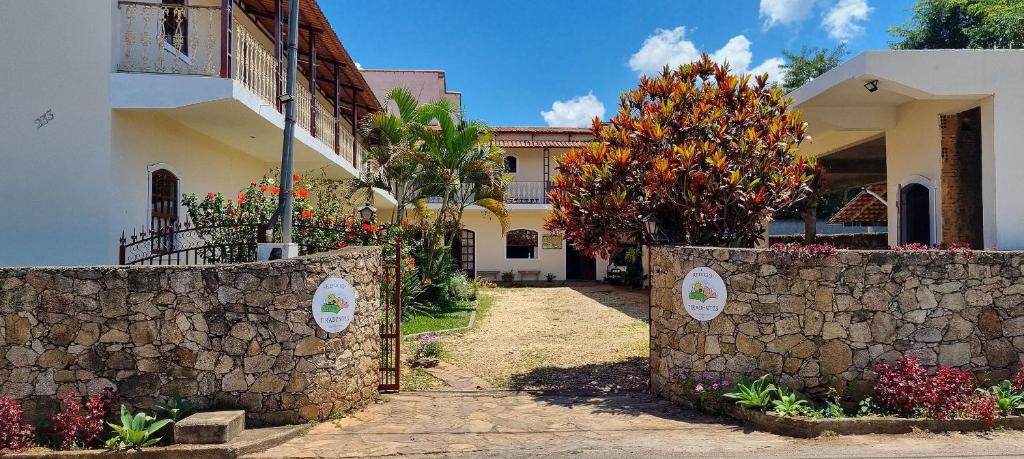 a stone wall in front of a house at Refúgio Tiradentes in Tiradentes