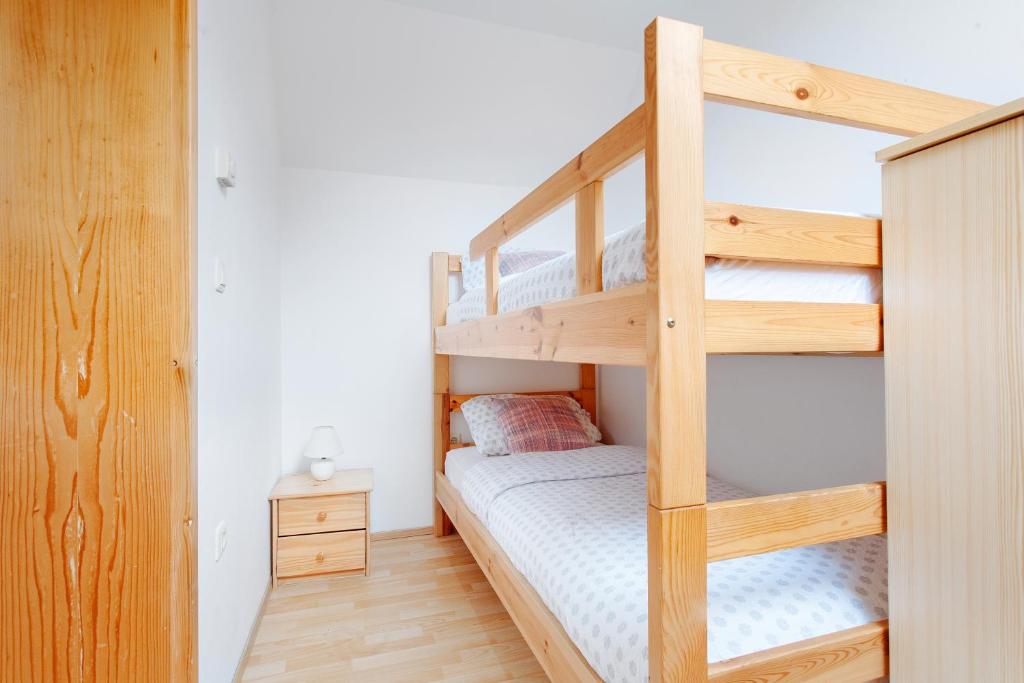 Postel nebo postele na pokoji v ubytování Apartments Prekmurska vas - Vital Resort