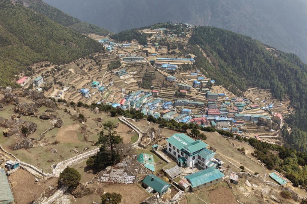 an aerial view of a village on a mountain at Sunshine lodge in Namche